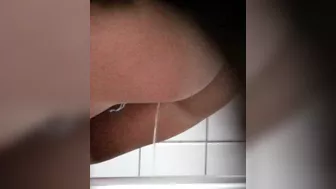 Two girls uses the toilet